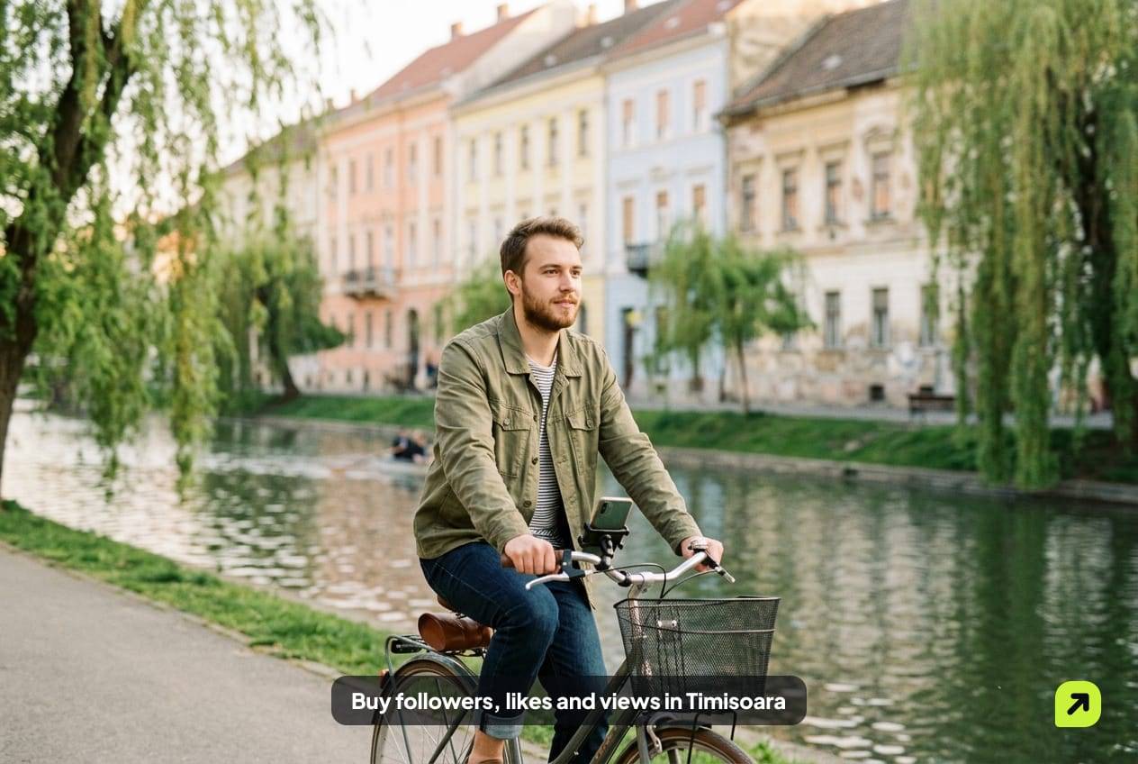 Cyclist on the Bega canal path in Timisoara on a spring evening with willows and pastel facades